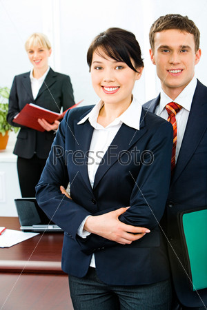 Image of successful business people standing in front