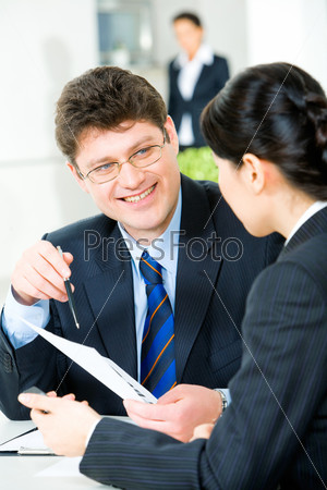 Image of self-confident manager during a working conversation with woman