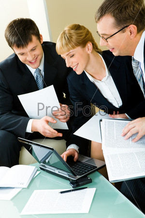 Portrait of three confident business people working together