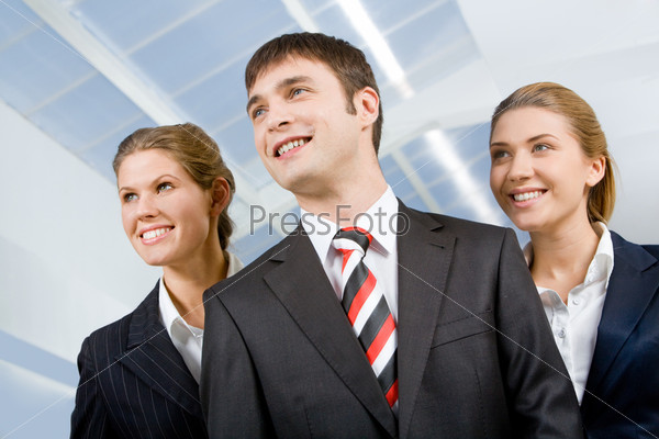 Image of business group of three perspective people looking away from camera