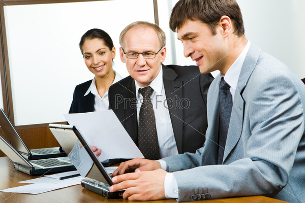 Portrait of confident business people working in the office