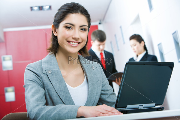 Image of pretty business woman looking at camera