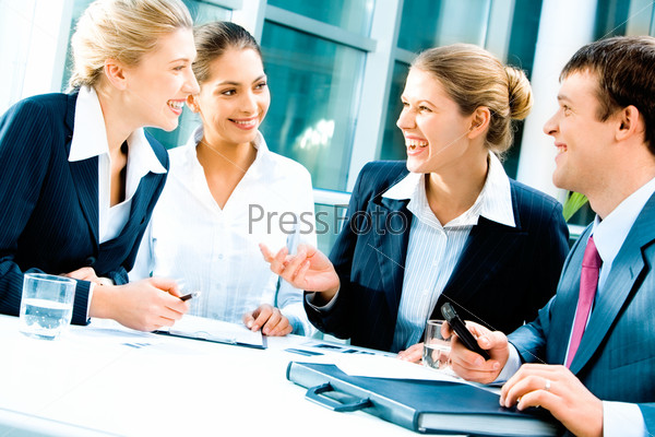 Image of laughing confident people planning a\
business-strategy