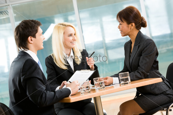 Photo of executive people interacting with each other and sharing their ideas at meeting