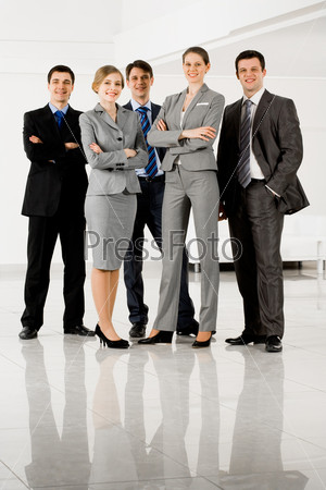 Portrait of confident businesspeople in smart suits standing on the floor