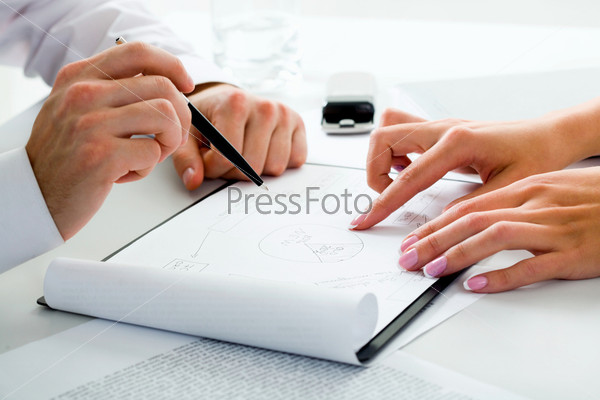 Image of business people’s hands in a working environment