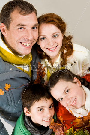 Happy family members looking at camera with smiles