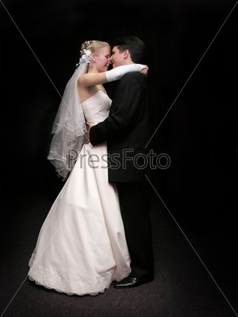 bride and groom dancing in the dark