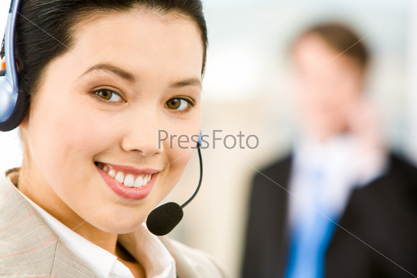 Face of attractive Customer Support Representative with a smile