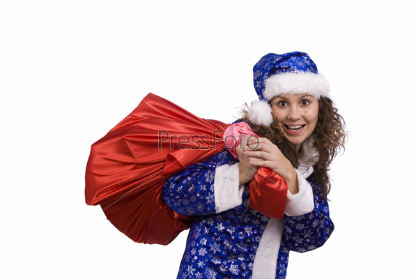 Santa woman dressing up in blue Christmas costume is holding red sack with gifts. Beautiful Snow Maiden holding a Christmas bag full of presents.