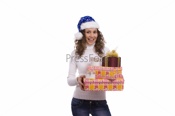 Attractive young woman in Winter / Christmas clothes on a white background holding gift box. Beautiful santa girl dressing up in blue Christmas cap with present stack.