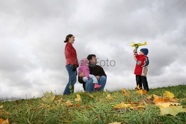 autumn family with plane