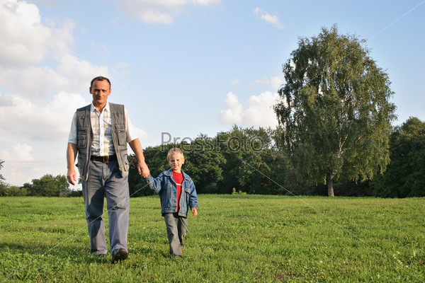 grandfather and boy walking