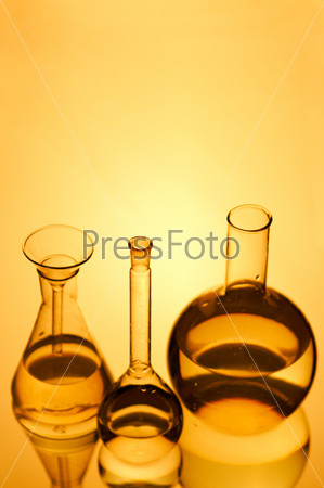 Laboratory flasks on turn blue background, stock photo