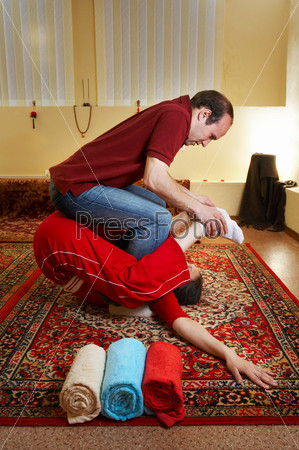 Thai massage is a type of massage in Thai style that involves stretching and deep massage, stock photo