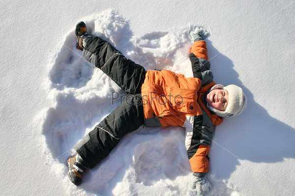 boy lies on north pole snow