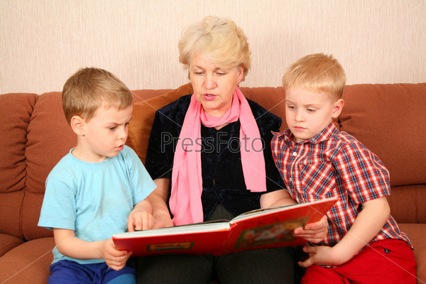 The grandmother and grandsons read the book