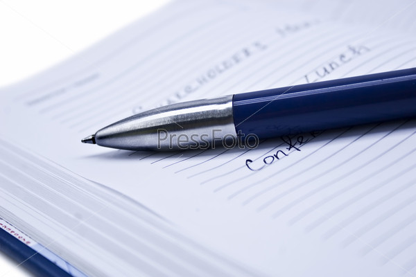 notepad and pen isolated on a white background