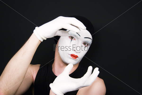 Portrait of mime in white gloves