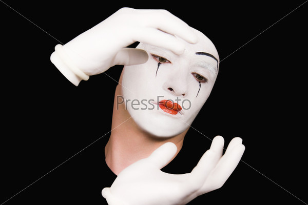 Portrait of mime in white gloves, stock photo