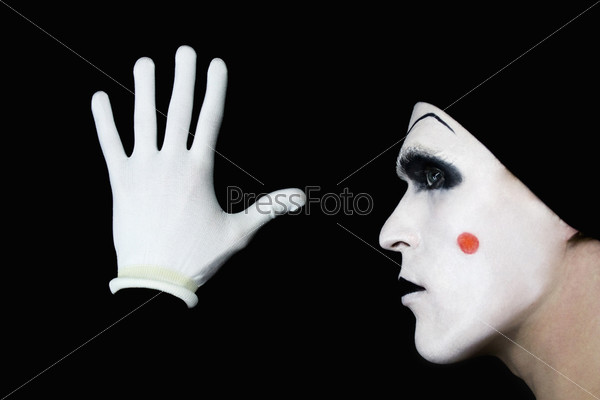 portrait of mime in white gloves
