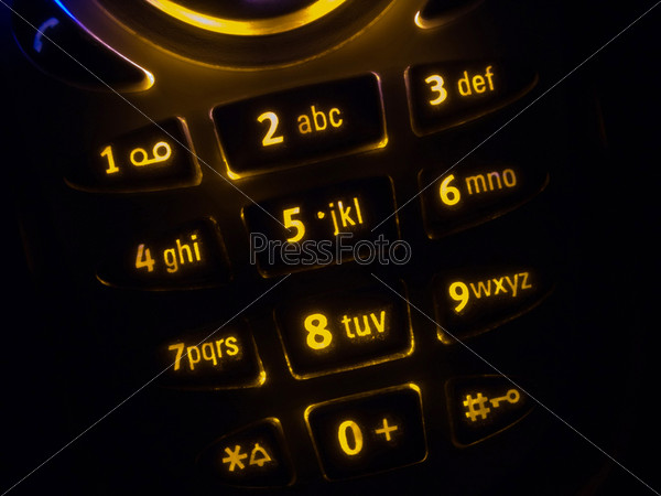 Mobile phone keypad back lit macro image on black