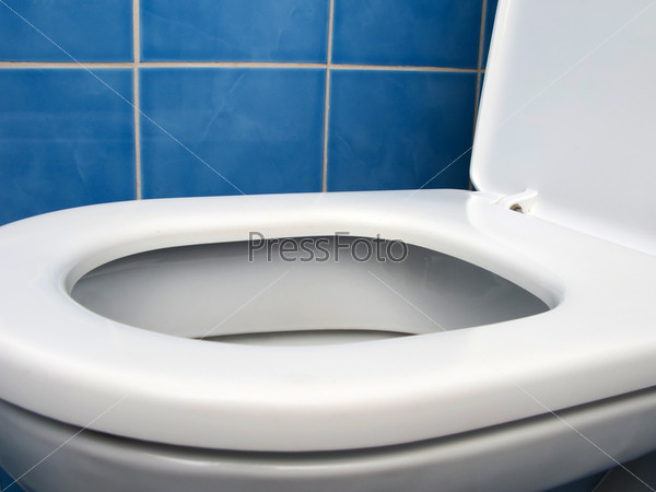 Home interior clean toilet sink bowl on tile floor, stock photo
