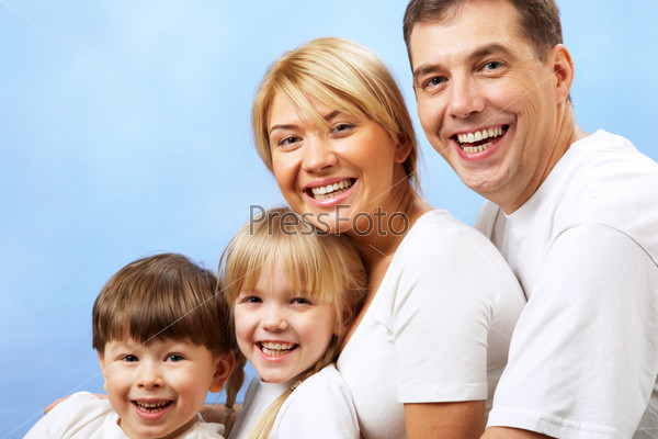 Portrait of joyful family laughing