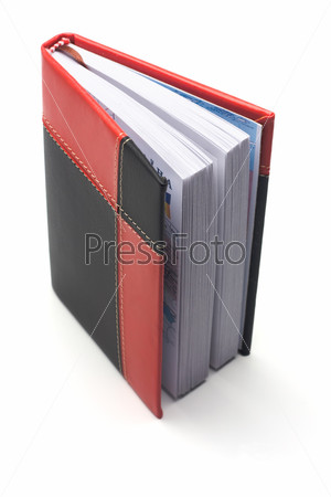 notepad in the red-black cover  isolated on white background