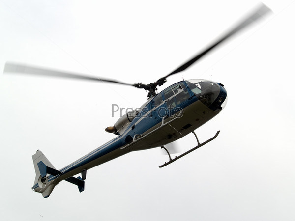 Civil helicopter hovering ready to climb and cruise