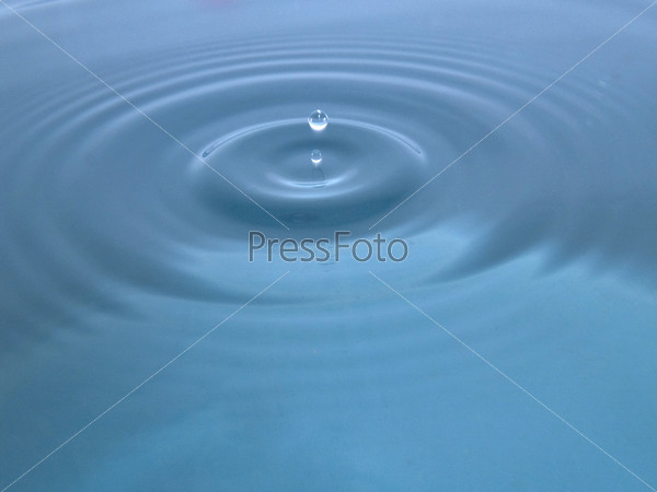 Two water droplets falling to water surface