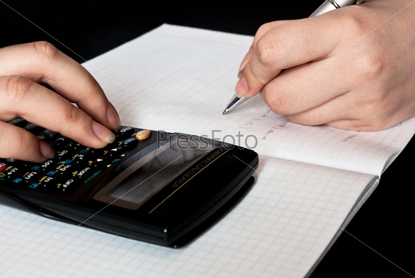 woman counting with a calculator