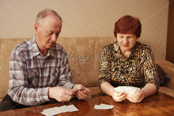 elderly pair play a game