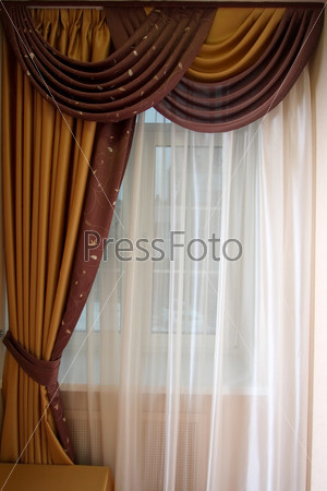 Beautiful curtain at a window\\
