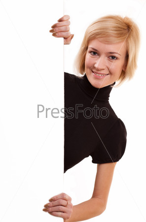 Beautiful Young Woman Peeping Over a Banner Over a White Background