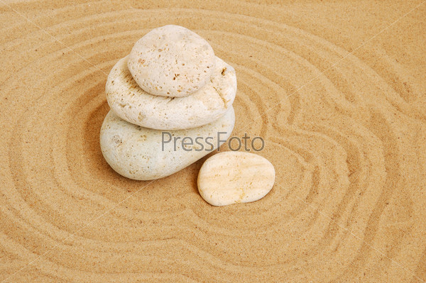 White stones on raked sand