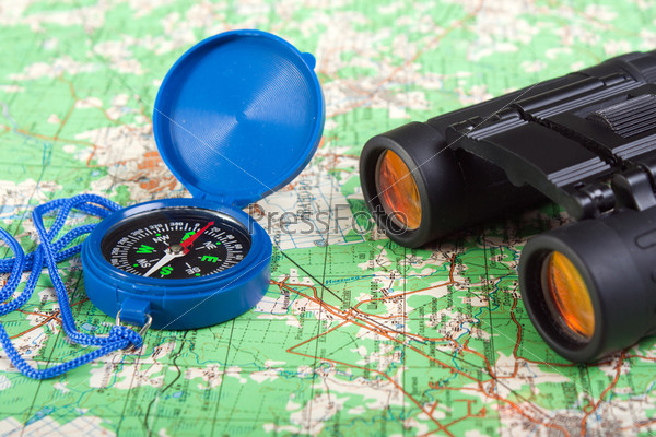 Travel north map direction compass and binoculars