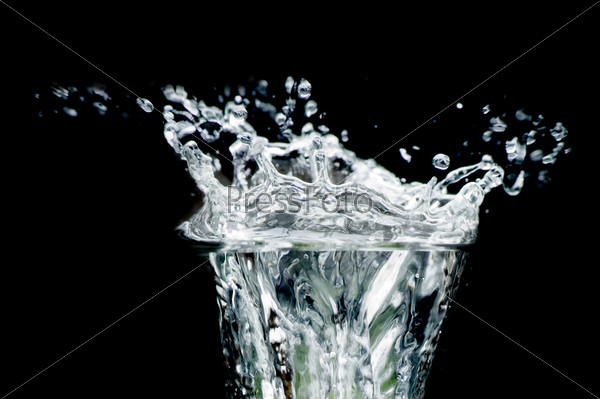 object on black - splash water close up
