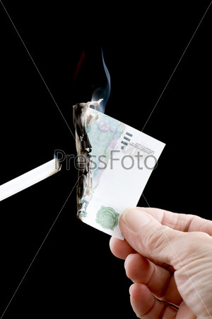 Burning money with cigarette