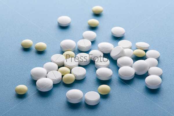 object on blue - Medical tablet close up