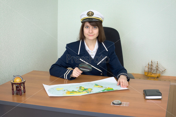 Girl in the form of the sea captain at office
