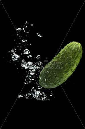 object on black - food Cucumber in water