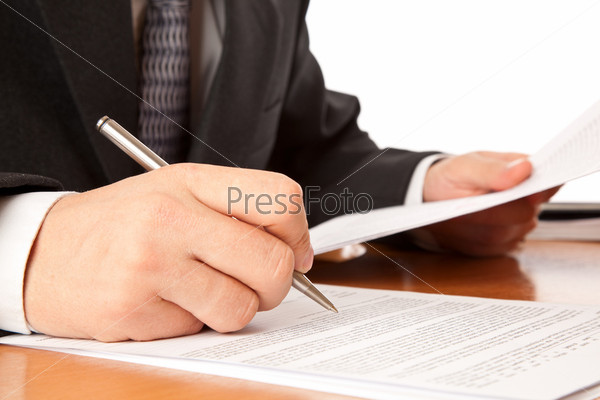 Businessman hands signing a contract.