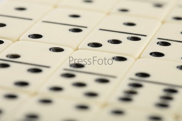 Background from white spotted dominoes pieces