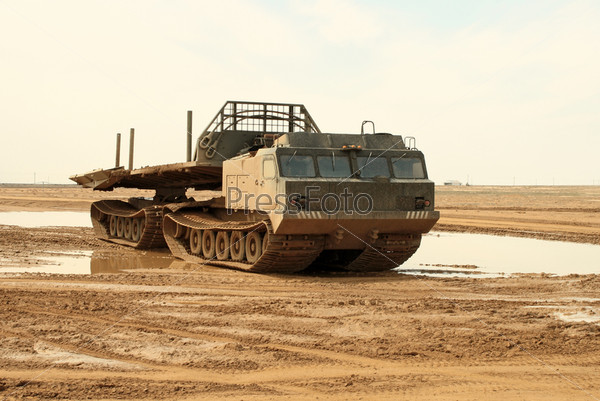 A powerful army truck all-terrain vehicle. Close-up. Day.