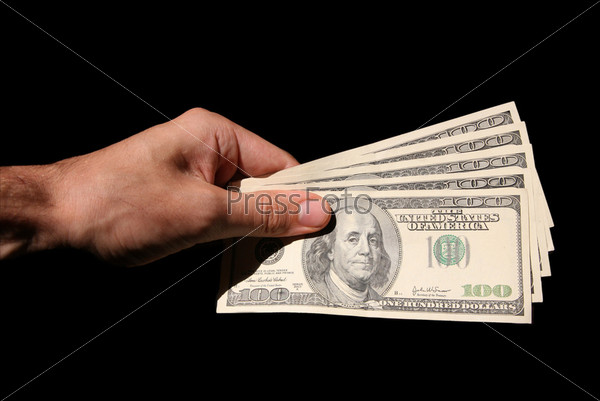 hand and dollars isolated on black backgrounds