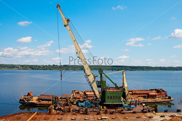 Hoisting crane on quay river Volga, stock photo