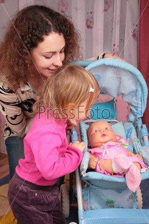 mother and small girl with the doll in the carriage