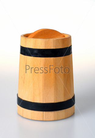 Wooden keg located on a white background