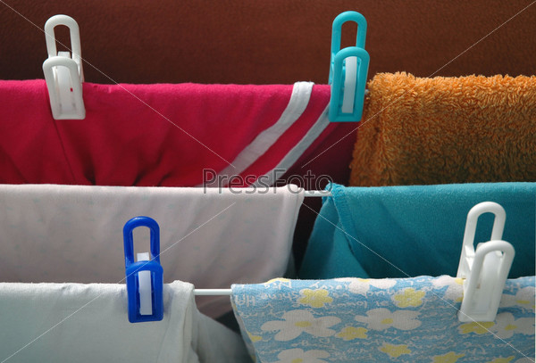 Colorful clothes hanging on clothes-peg